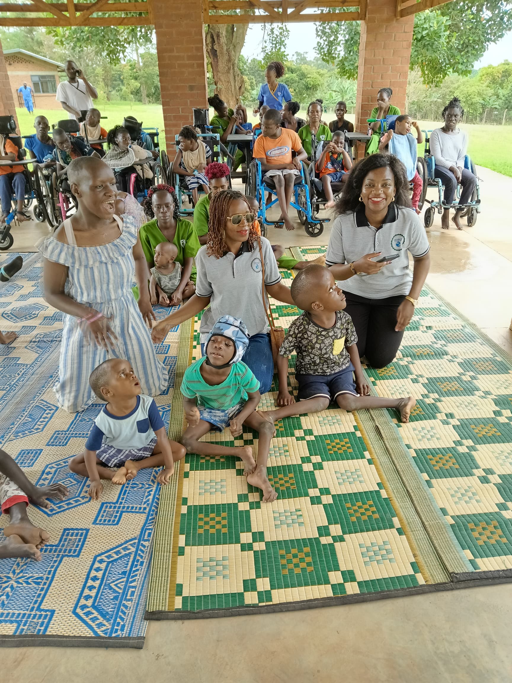 Foundation members posing with a group of children with special needs.